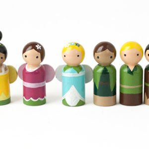 6 miniature fairy peg dolls standing in a row. 1 medium skinned yellow fairy with black top knot, 1 pale skinned pink fairy with brown bun, 1 pale skinned blue fairy with blond hair, 1 medium skinned elf with brown hair, 1 pale skinned elf with blond hair, 1 pale skinned elf with brown hair.