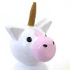 close up of 1 magical toys for kids unicorn standing. Pink muzzle and gold horn.