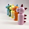 Side view of 5 dragon peg dolls vintage style toys standing in a line. 1 pink dragon, 1 orange dragon with wings, 1 yellow dragon, 1 green dragon with wings, 1 blue dragon