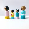 side view of 4 dark skinned family dolls standing in a row. 1 mother, 1 boy, 1 girl, and 1 dad