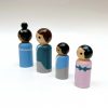 side view of 4 miniature wooden toys for kids standing in a row. 1 African American woman, one pale skinned man, 1 medium toned boy, 1 pale skinned girl all dressed in 19th Century Aristocrat attire.